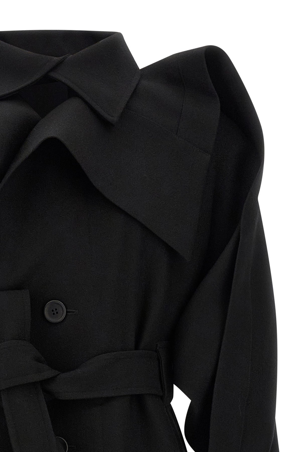 the calligraph issey miyake trench coat redefines classic volumes through a sc