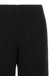 the hatching bottoms issey miyake trousers define a wide and fluid silhouette