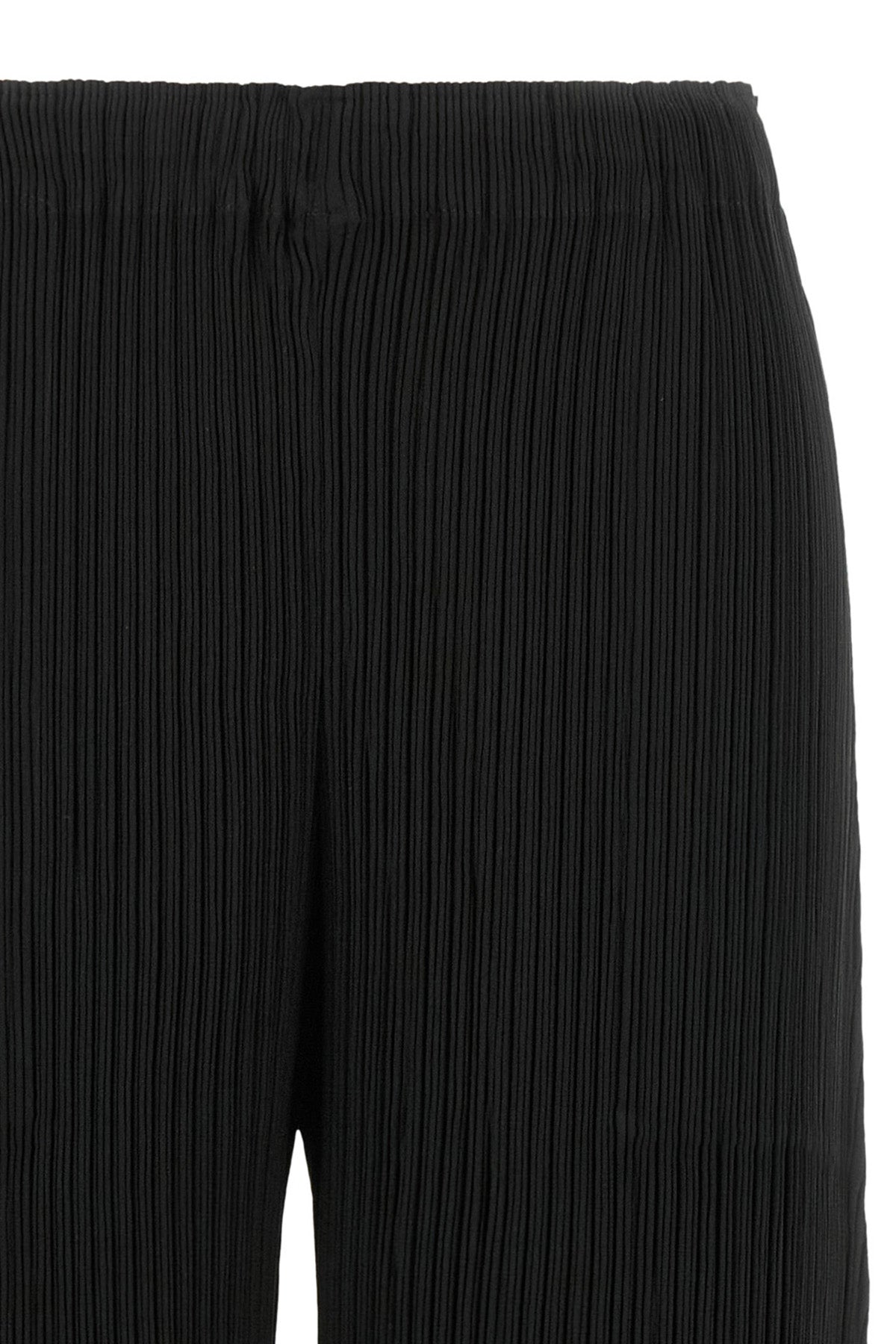 the hatching bottoms issey miyake trousers define a wide and fluid silhouette