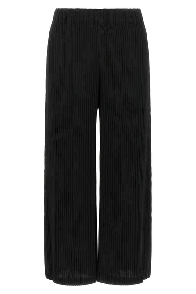 the hatching bottoms issey miyake trousers define a wide and fluid silhouette