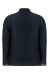 the wooly pleats-68 issey miyake cardigan redefines volumes through a complex