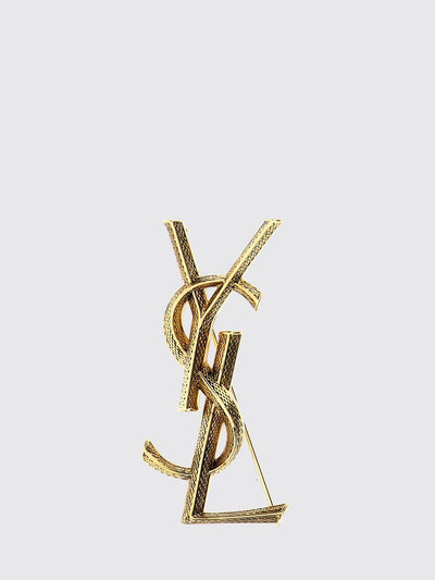 cassandre ysl monogram brooch in golden brass