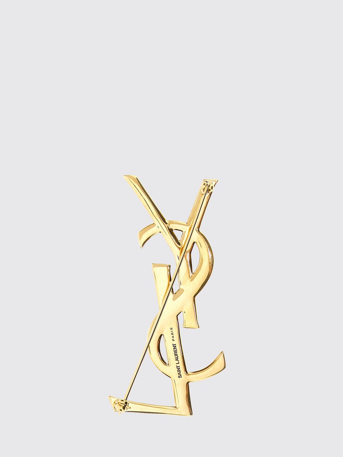 cassandre ysl monogram brooch in golden brass