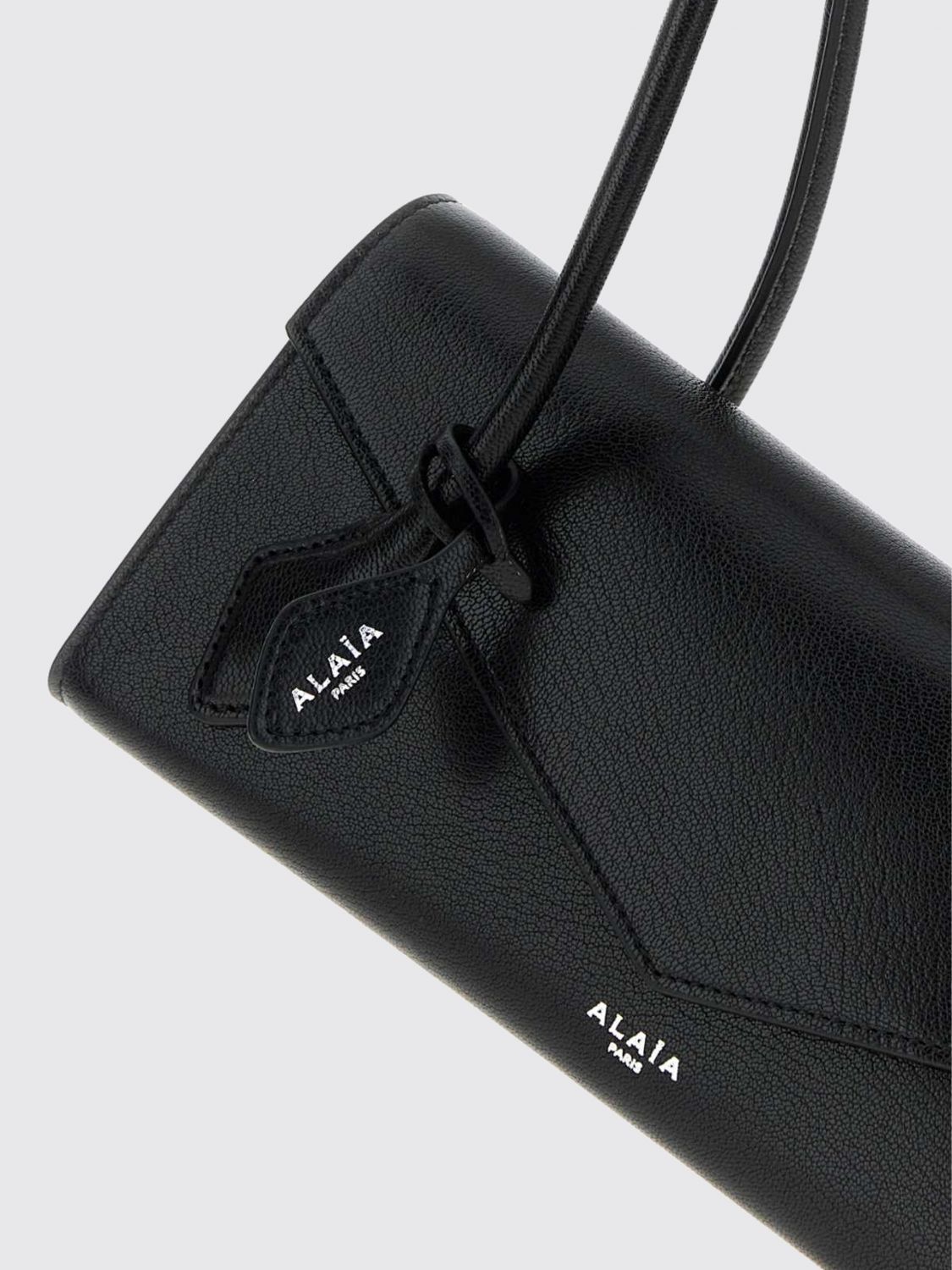 le teckel sheepskin leather shoulder bag with flap closure