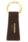 the jil sander linea keyring defines a minimal aesthetic through rigorous geom