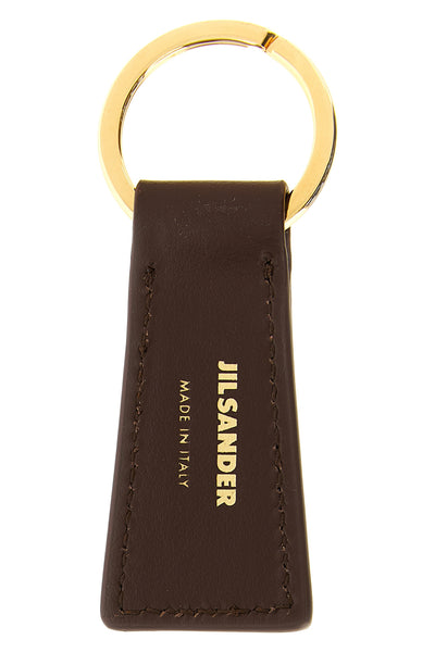 the jil sander linea keyring defines a minimal aesthetic through rigorous geom