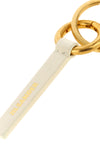 the jil sander keyring redefines essentiality through rigorous construction and