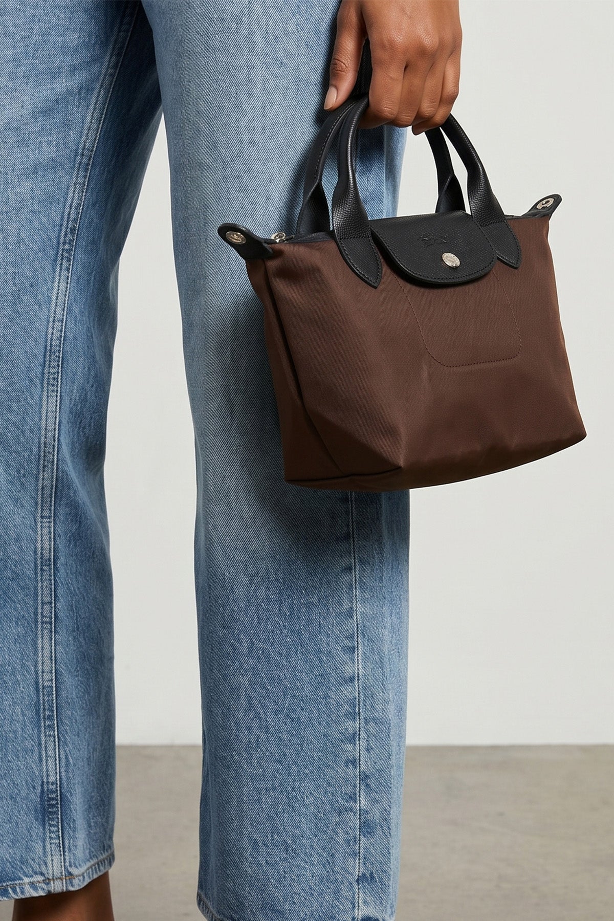 the longchamp xs le pliage energy handbag features a compact silhouette