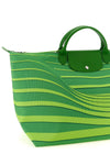 the longchamp le pliage maison unique travel bag stands out for its trapezoidal