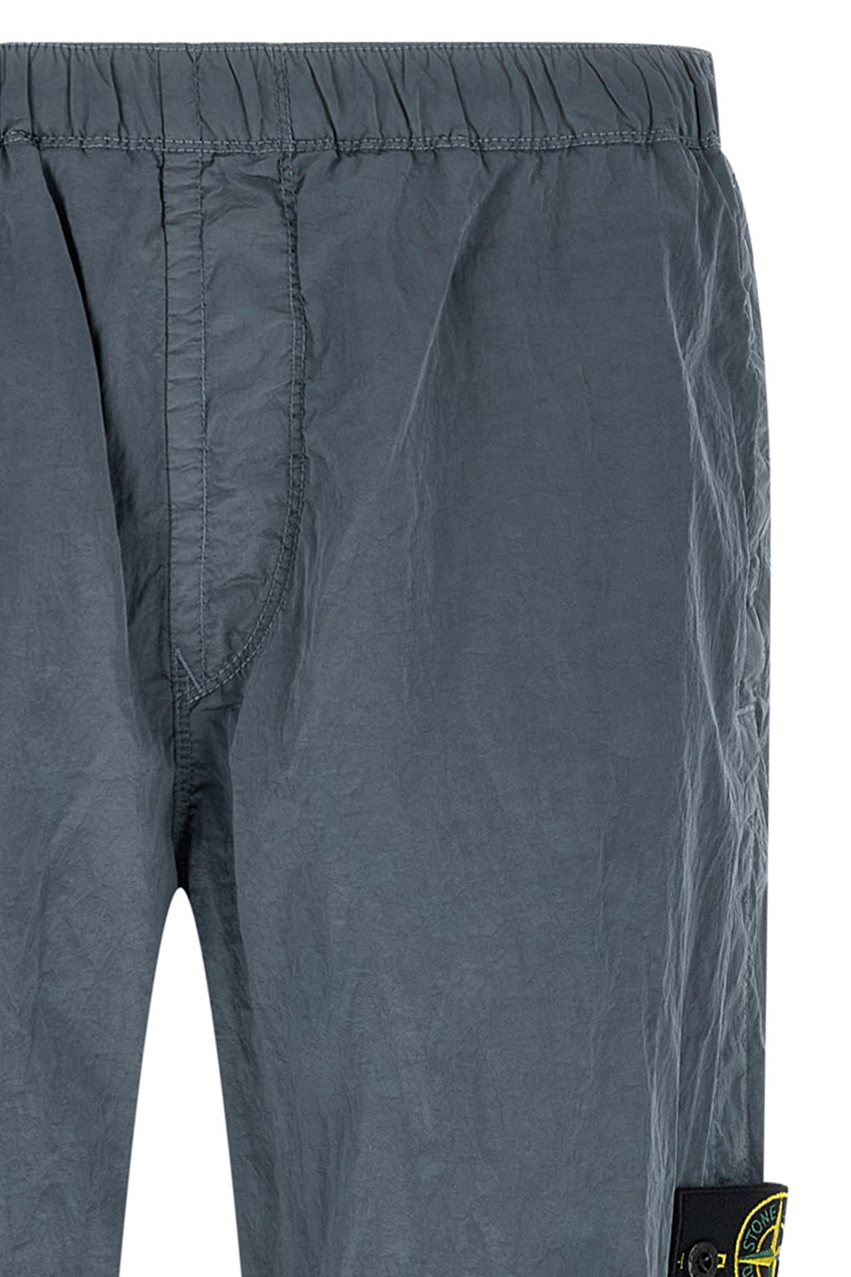 3100035 joggers in stone island nylon metal fabric subjected to a double wrink