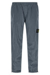 3100035 joggers in stone island nylon metal fabric subjected to a double wrink