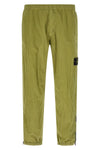 3100035 joggers in stone island nylon metal fabric subjected to a double wrink