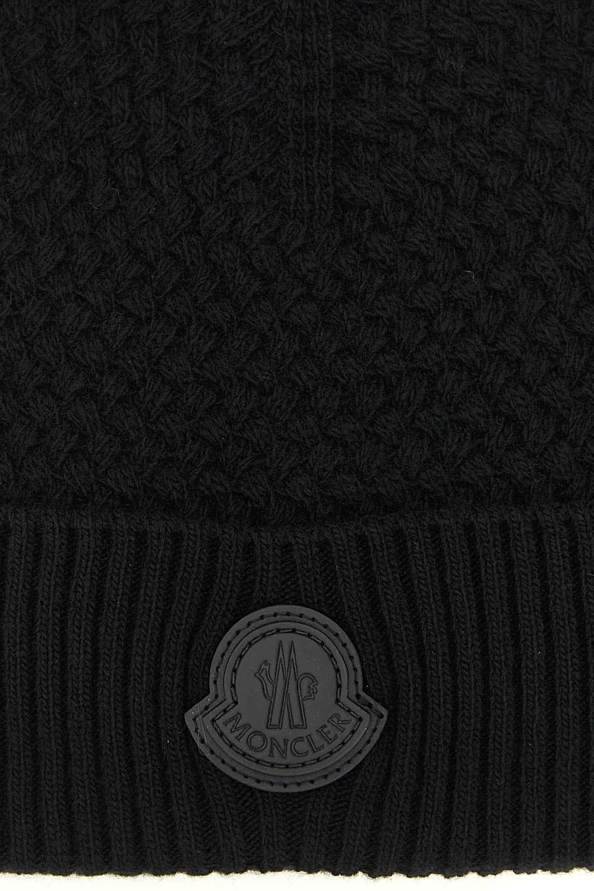 the moncler cap presents a sophisticated approach to winter accessories through