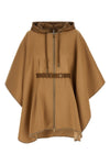 the moncler virgin wool blend cape is distinguished by a draped silhouette and m