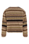 the moncler cardigan stands out for its structured construction in wool blend