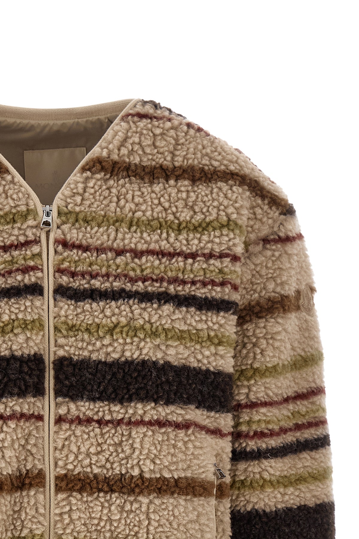 the moncler cardigan stands out for its structured construction in wool blend