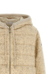 the moncler sweatshirt stands out for its hybrid construction that combines knit