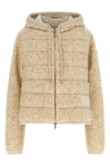 the moncler sweatshirt stands out for its hybrid construction that combines knit