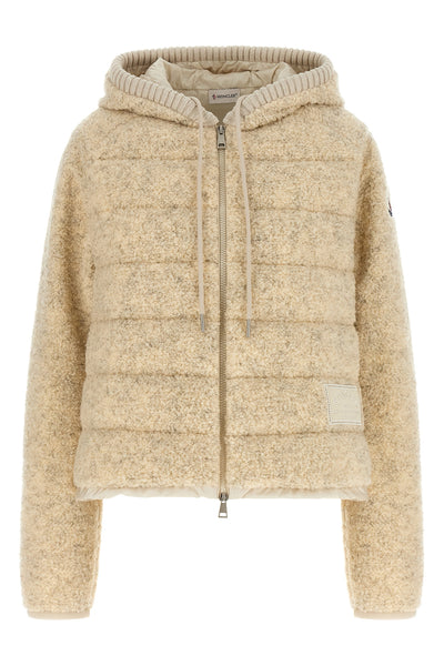 the moncler sweatshirt stands out for its hybrid construction that combines knit
