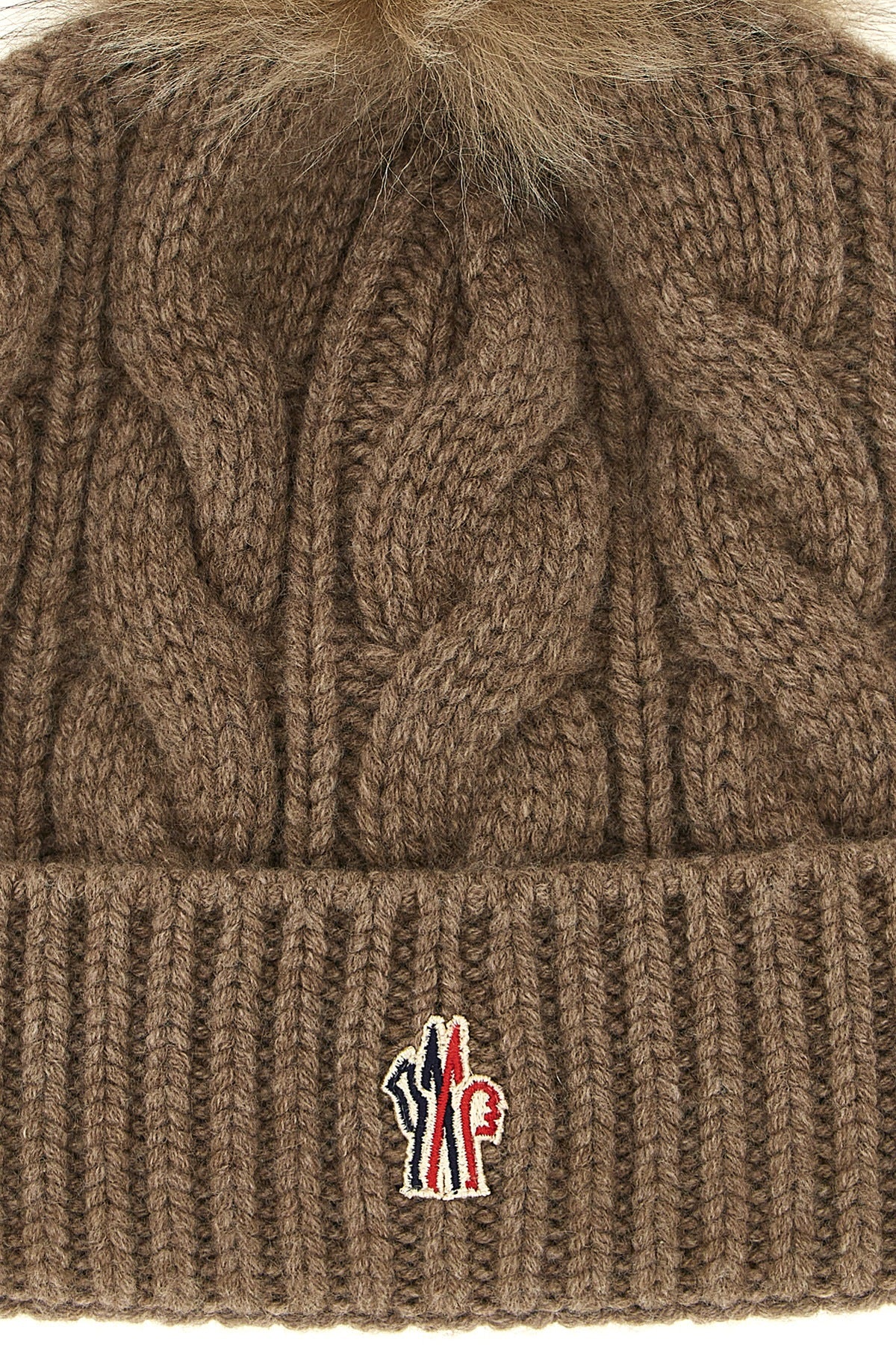 the moncler grenoble cap defines winter clothing through technical construction