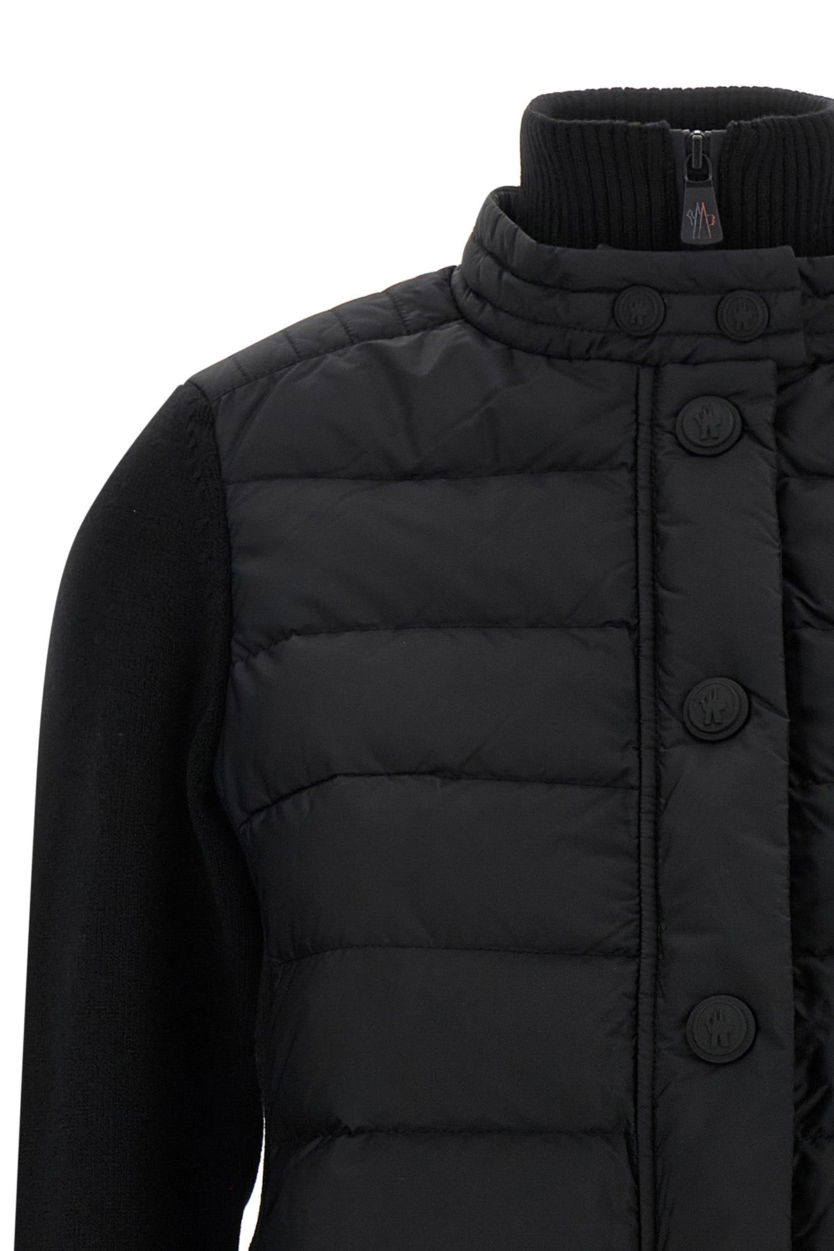 the moncler grenoble cardigan stands out for its hybrid construction that combin
