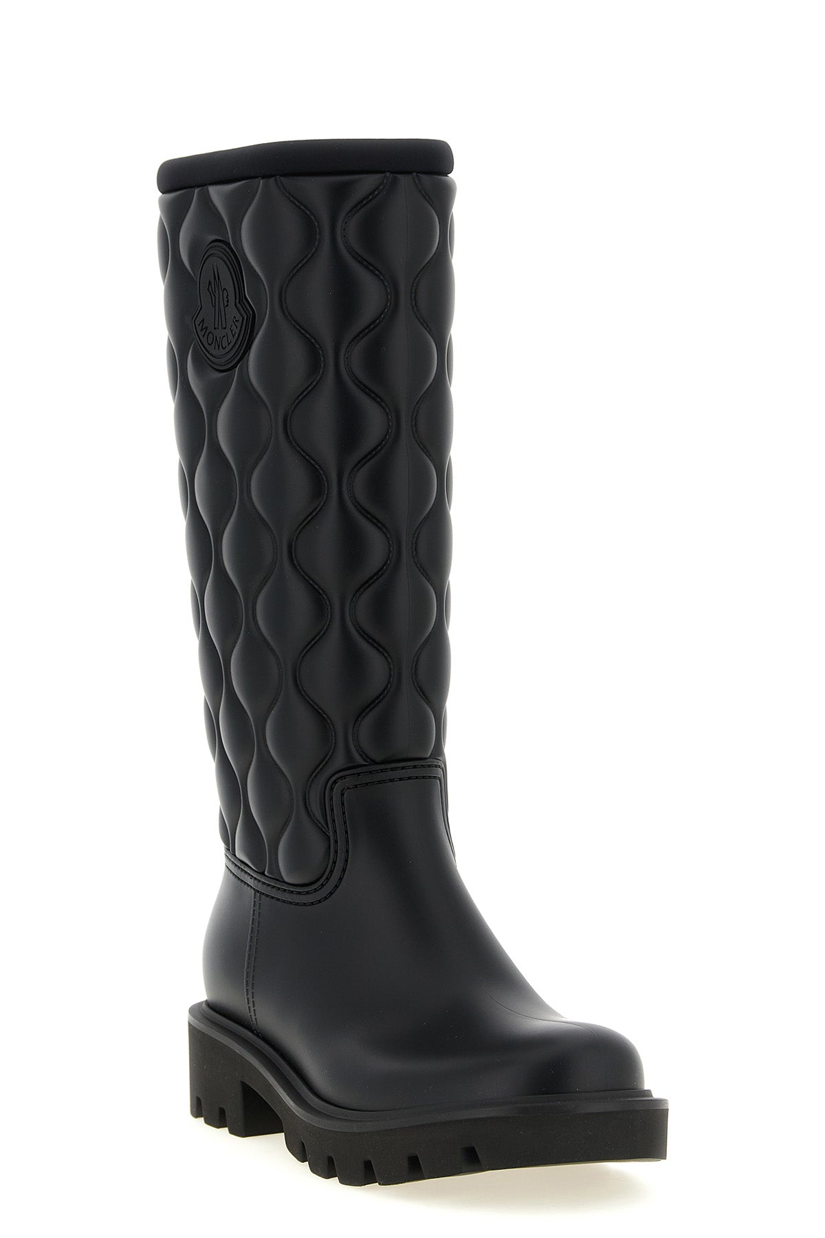 moncler kickstream high boots redefine functional outerwear through a rigorous a