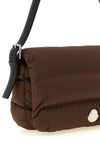 the moncler caradoc shoulder bag redefines the codes of outerwear through a bagu