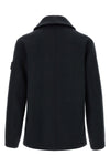 the stone island outerwear in a deep navy blue nuance imposes itself