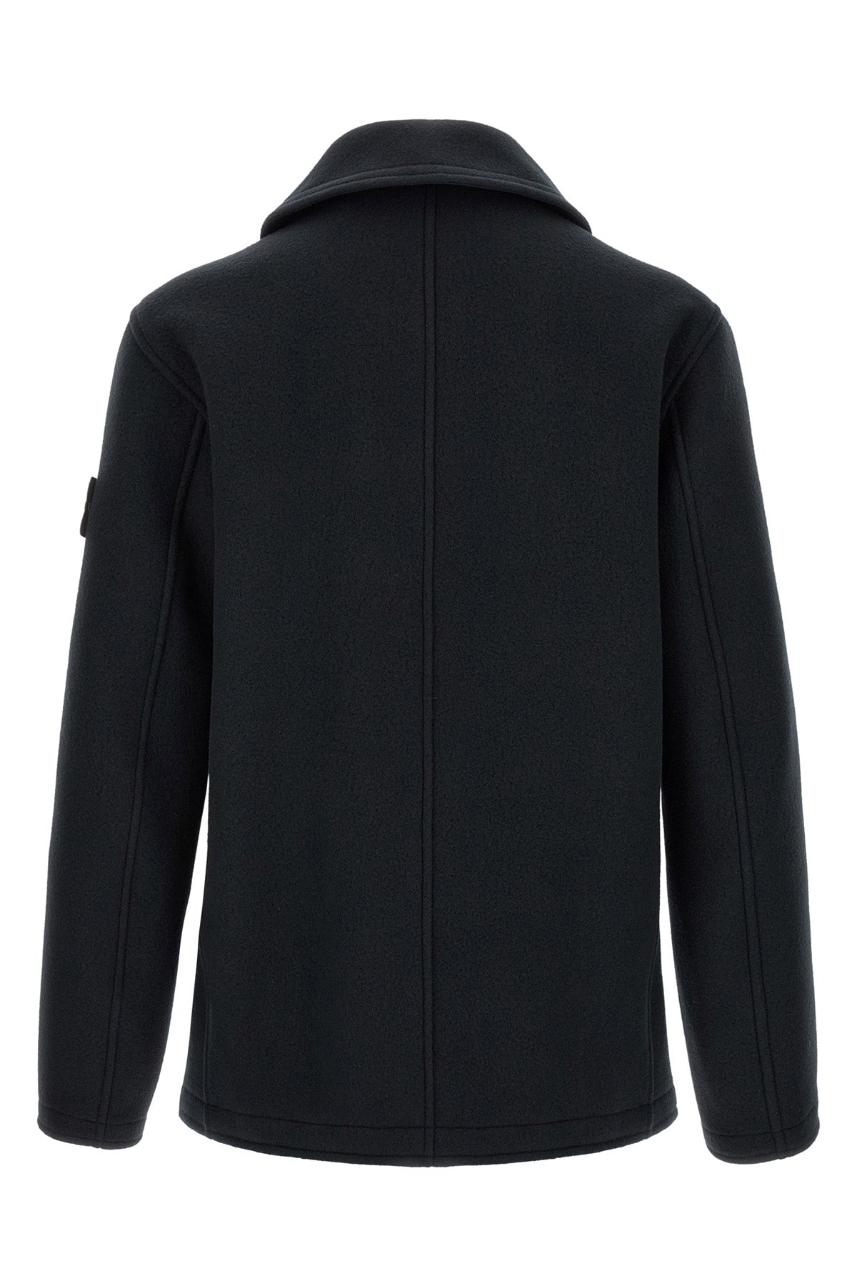 the stone island outerwear in a deep navy blue nuance imposes itself