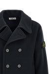 the stone island outerwear in a deep navy blue nuance imposes itself