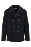 the stone island outerwear in a deep navy blue nuance imposes itself