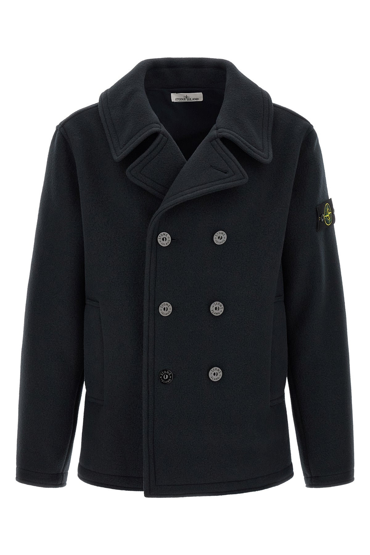 the stone island outerwear in a deep navy blue nuance imposes itself