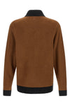 the cardigan born from the collaboration between adidas statement and song for t
