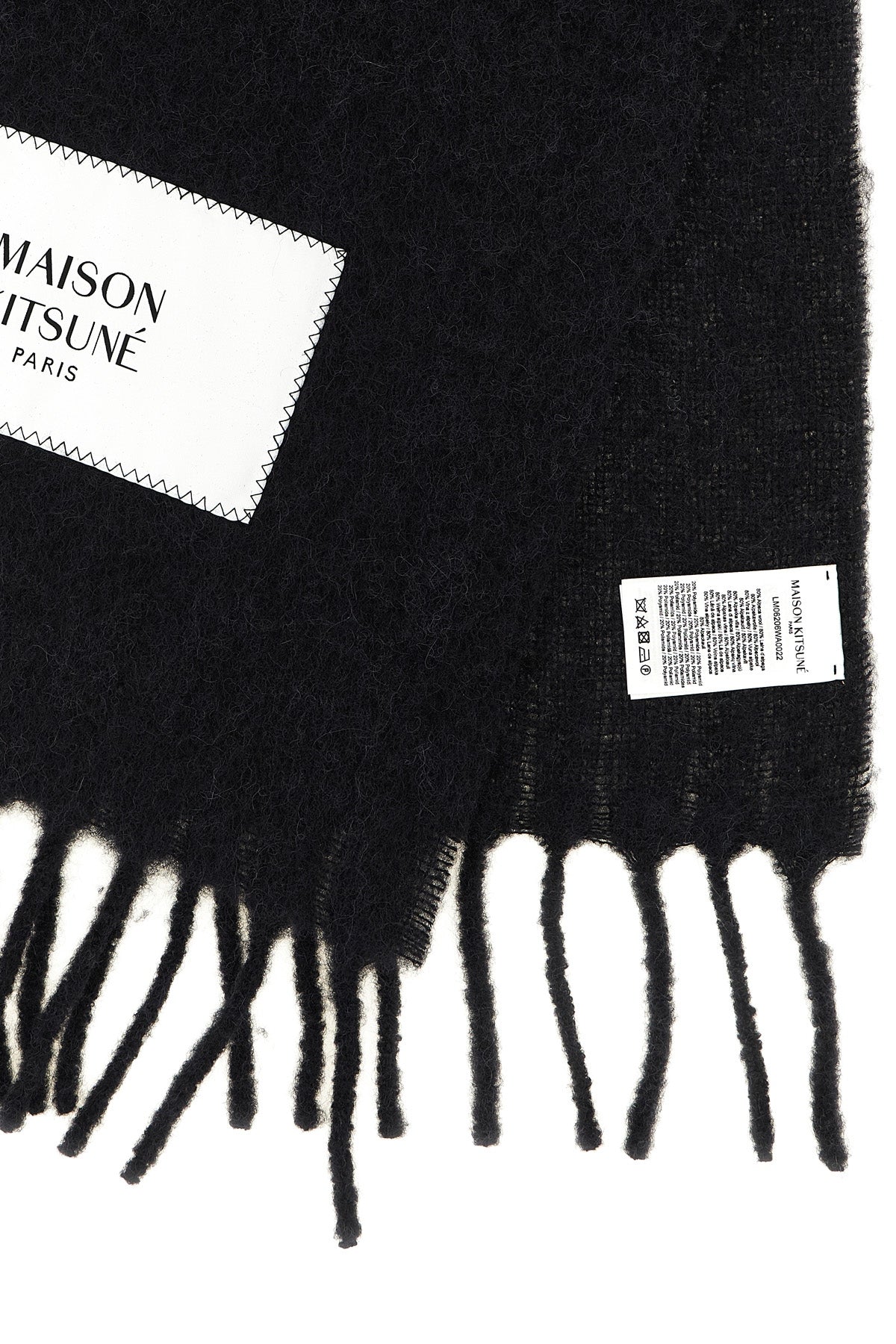 the maison kitsuné scarf is distinguished by an elongated rectangular constructi