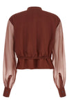the brunello cucinelli blouse exemplifies the brands mastery in material contra
