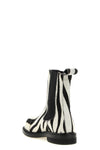 moschinos chelsea ankle boots redefine urban aesthetics through world-class man