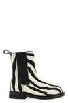 moschinos chelsea ankle boots redefine urban aesthetics through world-class man