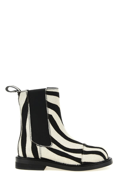 moschinos chelsea ankle boots redefine urban aesthetics through world-class man