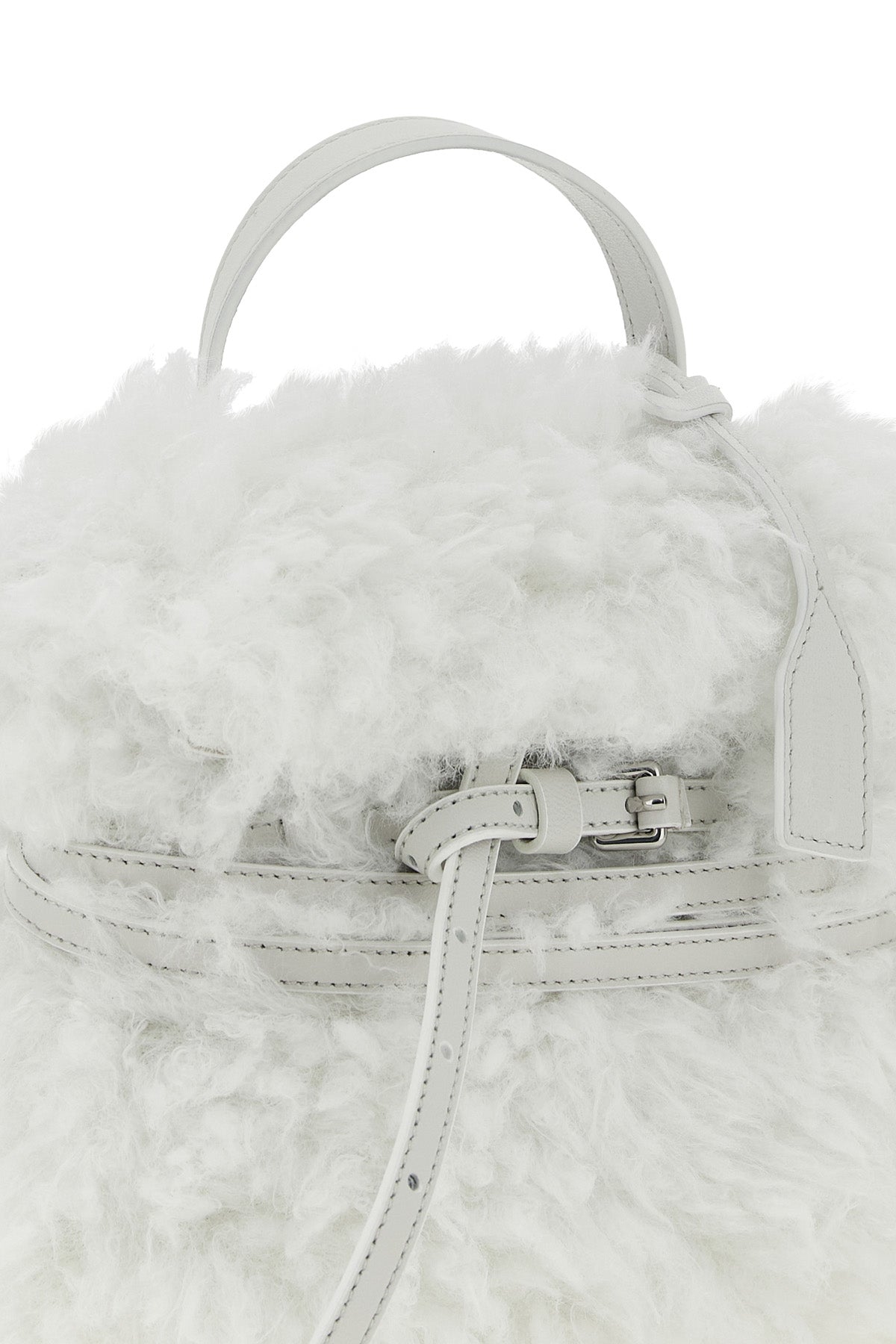moschinos tie me small handbag stands out for its soft and unstructured silho