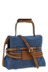 the moschino tie me regular handbag in structured blue denim stands out for a