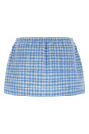 the miu miu miniskirt redefines casual volumes through a short and structured si