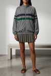 the miu miu mini skirt reinterprets the codes of the collegiate wardrobe through