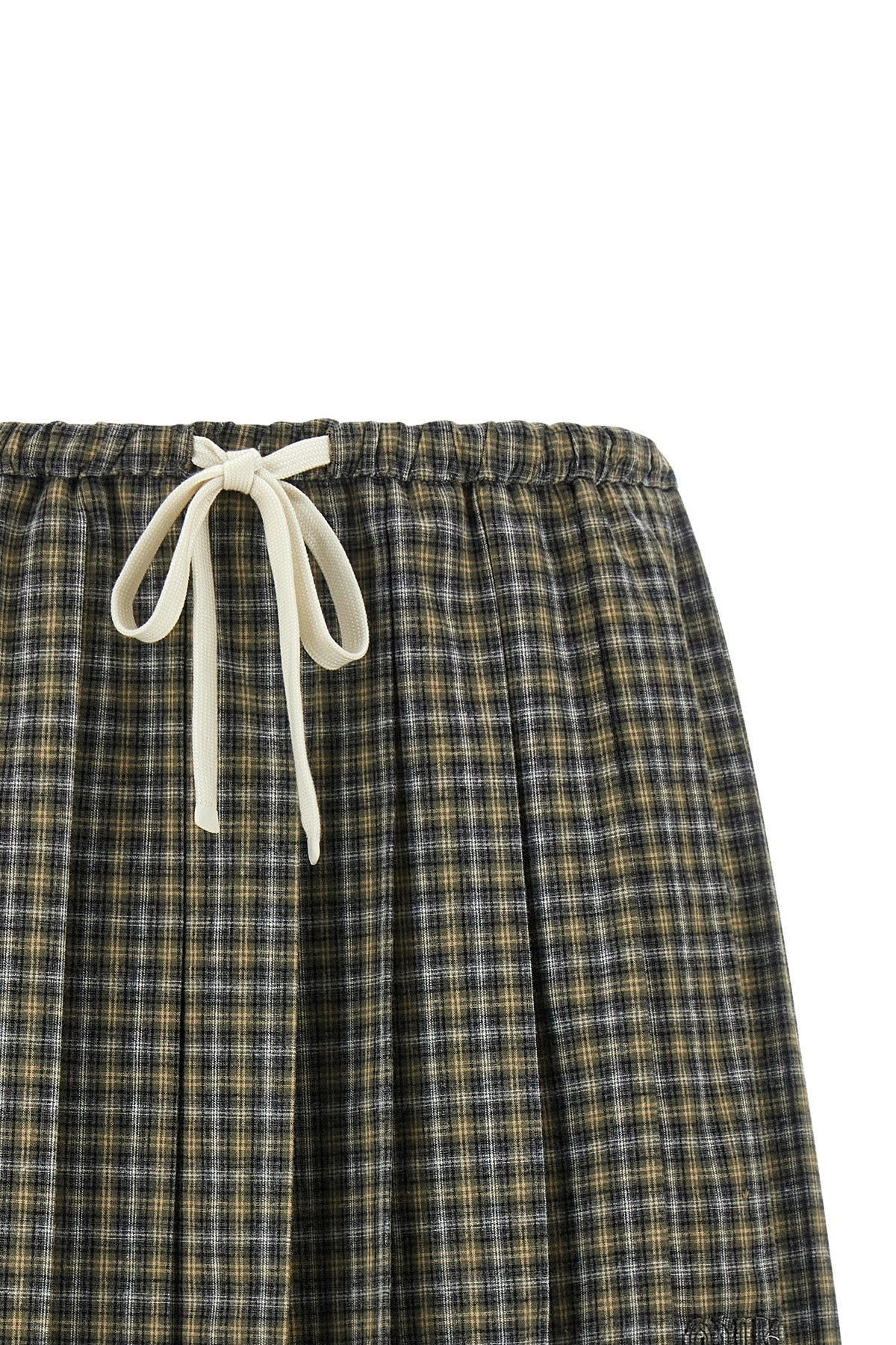 the miu miu mini skirt reinterprets the codes of the collegiate wardrobe through