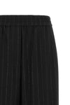 brunello cucinelli trousers redefine sartorial codes through a loose and relaxed