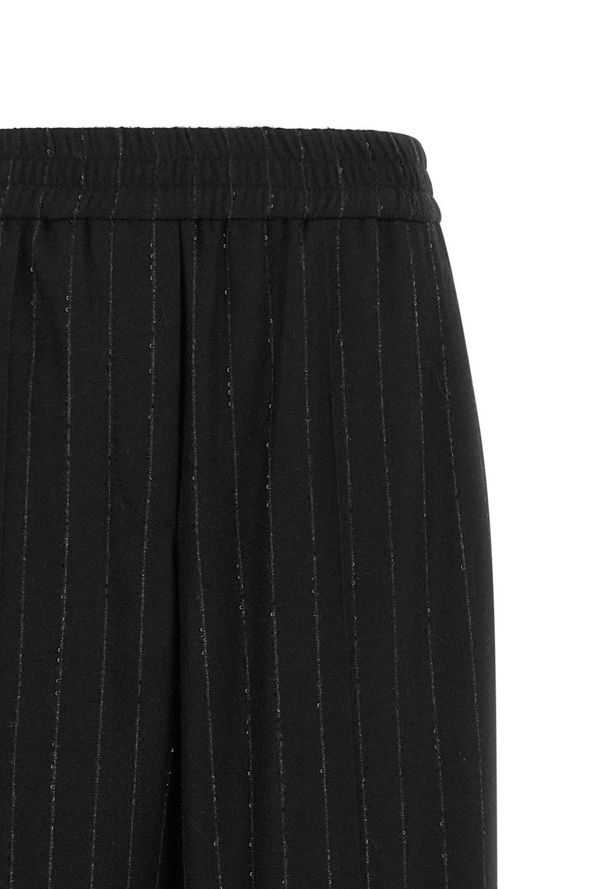 brunello cucinelli trousers redefine sartorial codes through a loose and relaxed