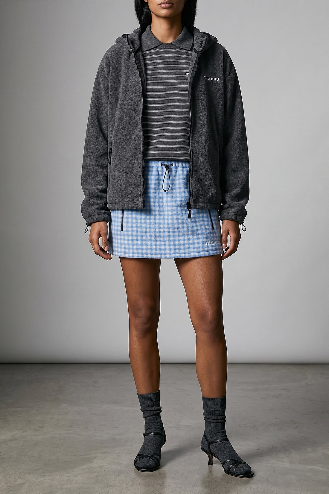 MIU MIU M the miu miu striped polo shirt redefines casual luxury through a precise sartori