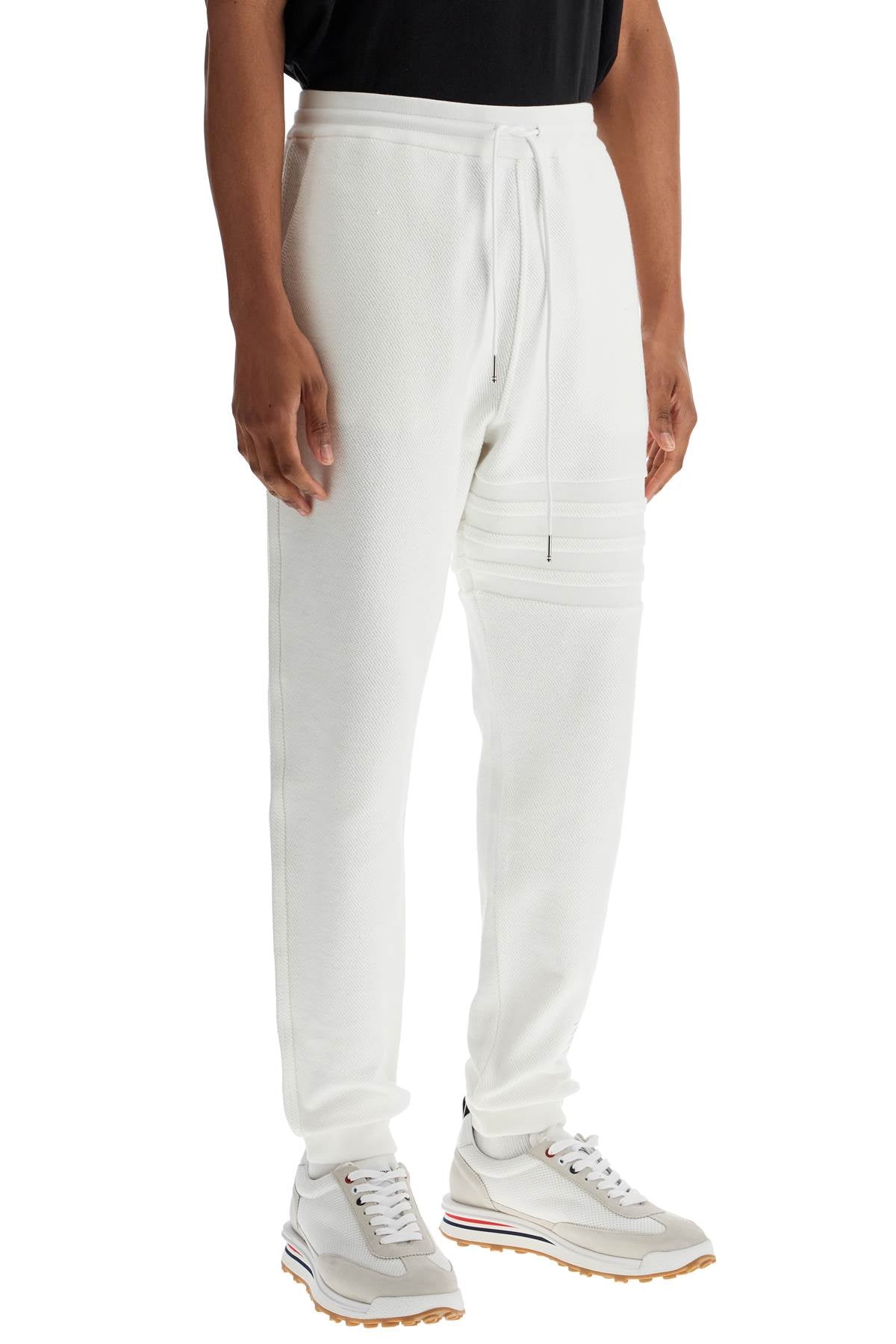 white cotton sweatpants with 4 stripes