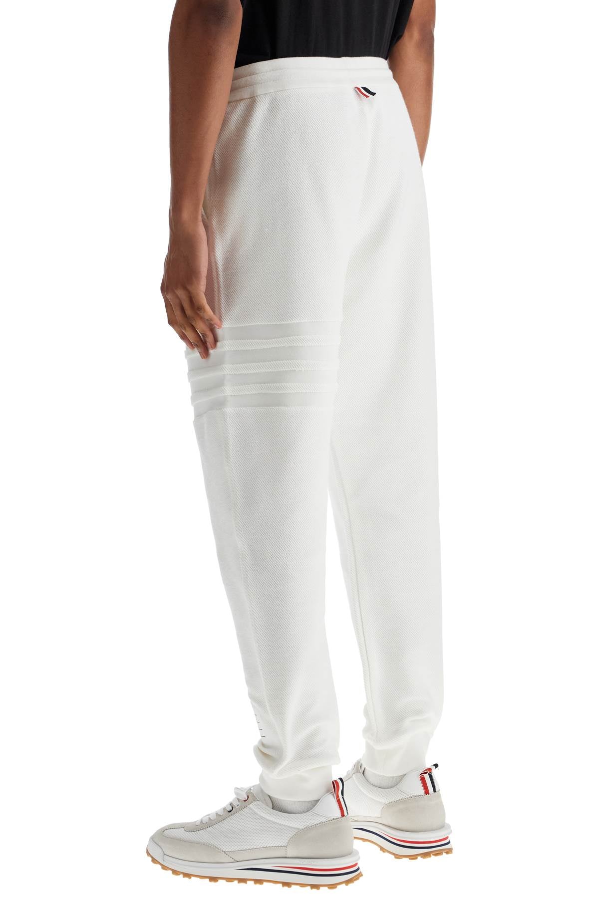 white cotton sweatpants with 4 stripes