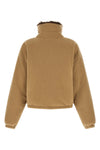 miu miu short down jacket redefines volumes through a compact and structured sil