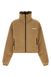 miu miu short down jacket redefines volumes through a compact and structured sil